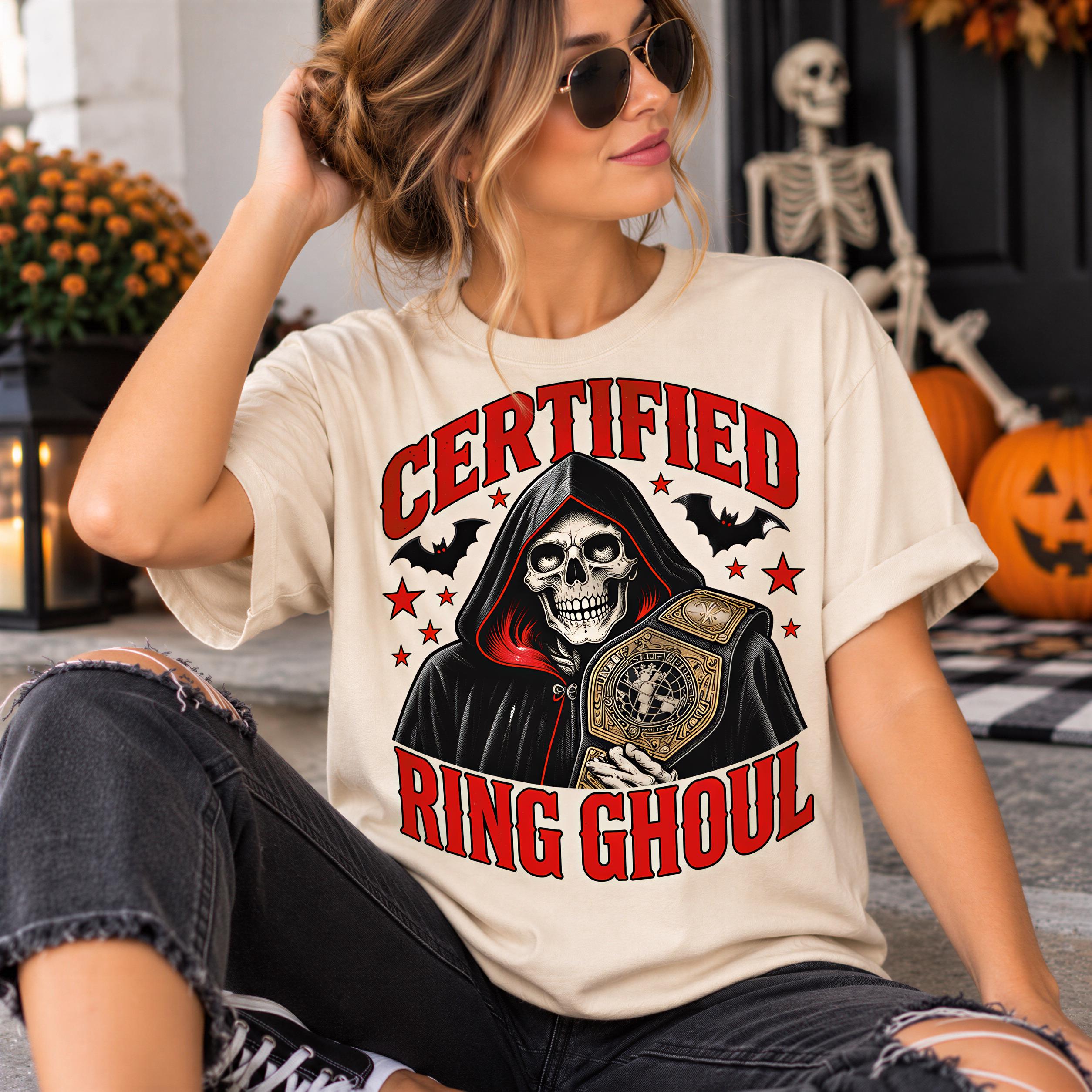 A woman wearing a white t-shirt with a graphic design of a skeleton holding a championship belt, with the text "Certified Ring Ghoul" printed on it.
