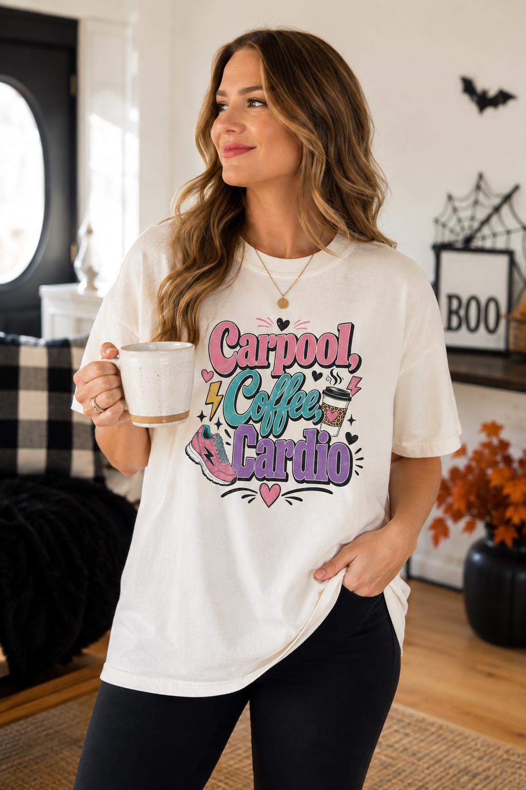 A woman wearing a white t-shirt with a colorful graphic design and holding a coffee mug stands in a room with a black and white checkered couch and a potted plant.