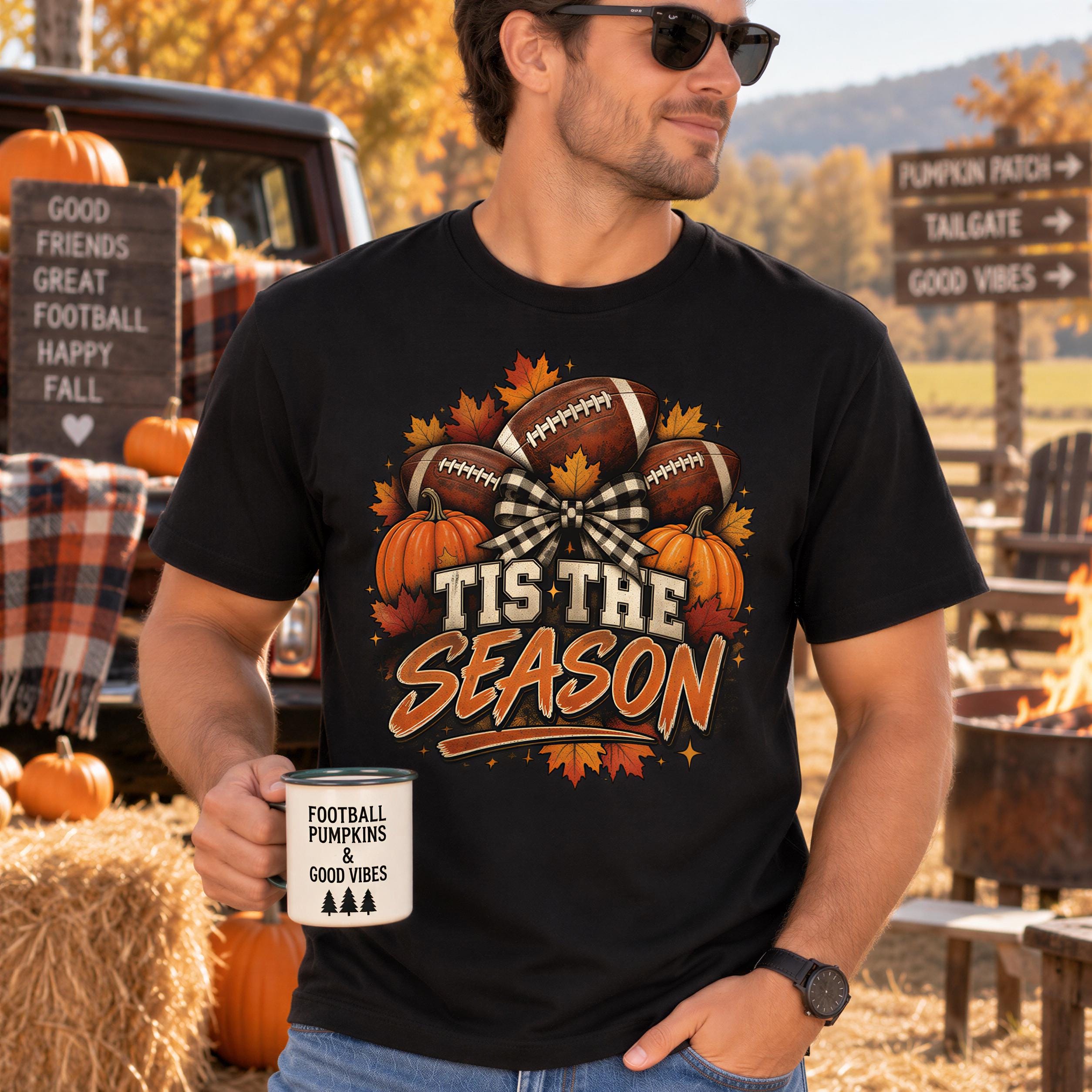 A man wearing a black t-shirt with a graphic design of footballs and pumpkins, holding a coffee mug with the text "Tis the season" printed on it.