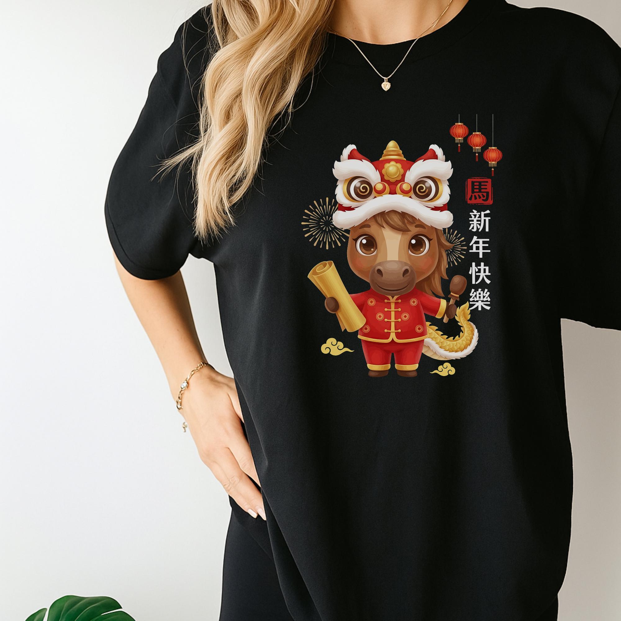 A person wearing a black t-shirt with a Chinese New Year design featuring a lion character holding a scroll and surrounded by Chinese characters.