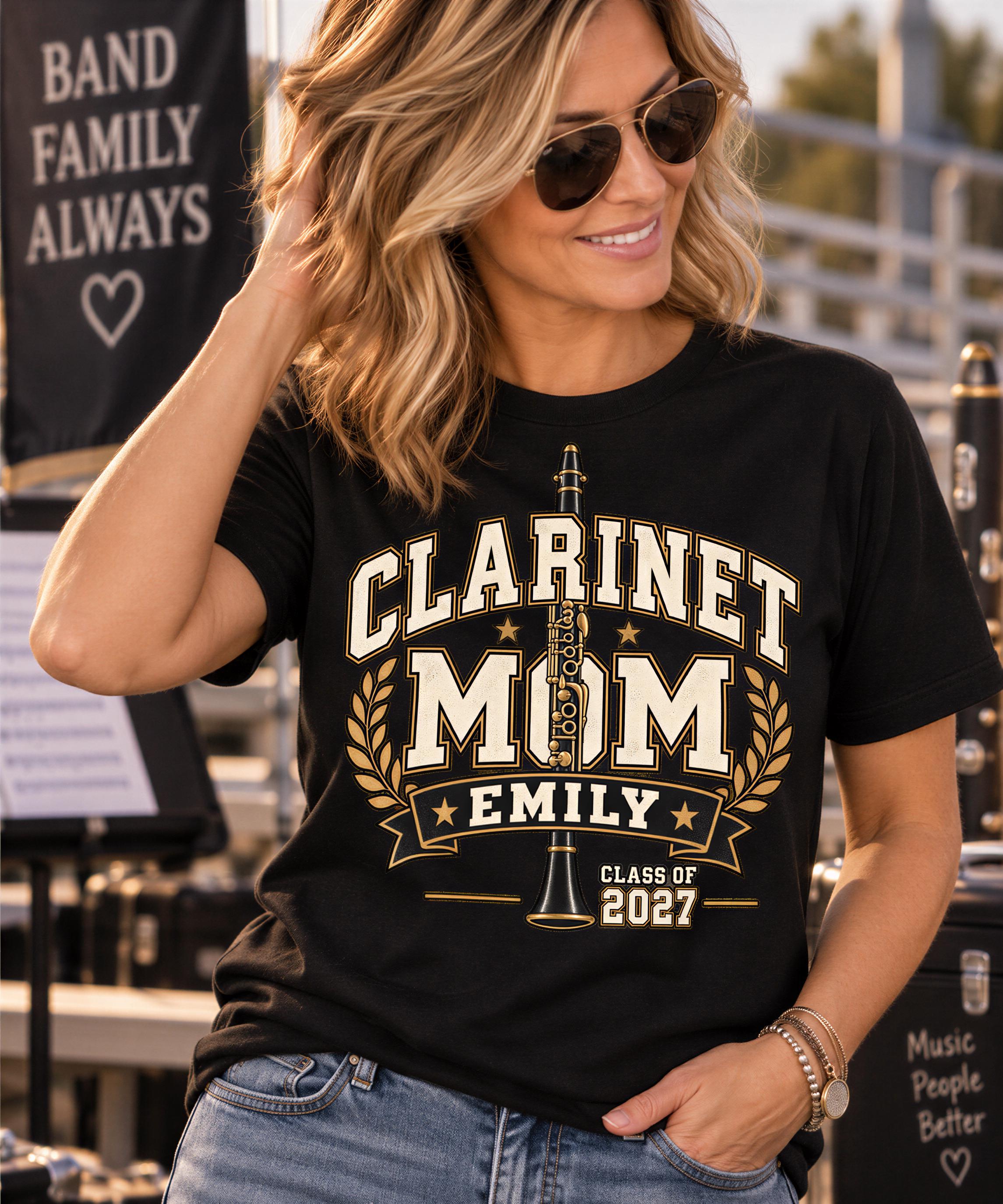 A woman wearing a black t-shirt with a graphic design and text, smiling and posing for a photo.