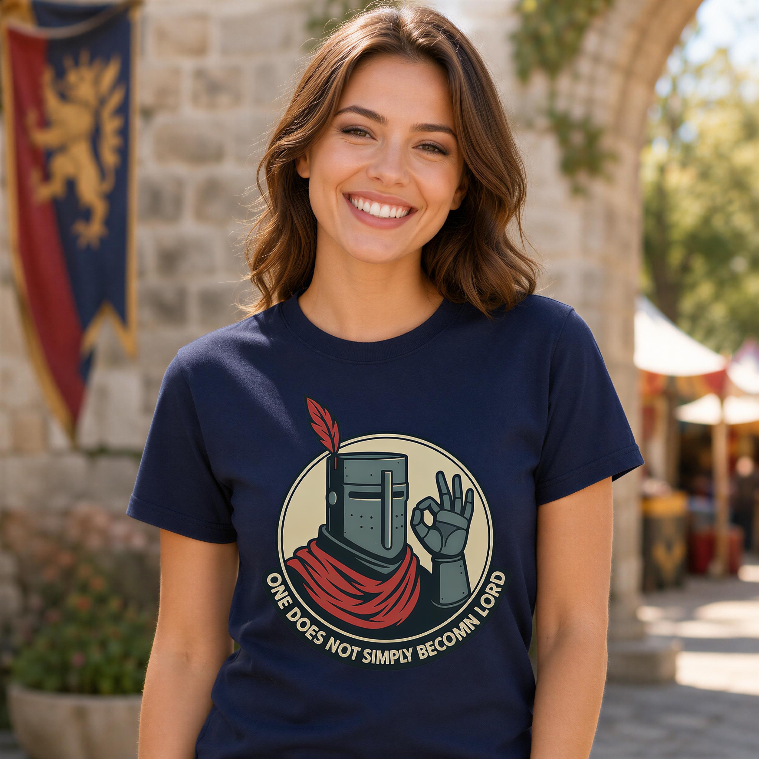 A smiling woman wearing a navy blue t-shirt with a graphic design of a knight in a red cape and the text "One does not simply become a hero".
