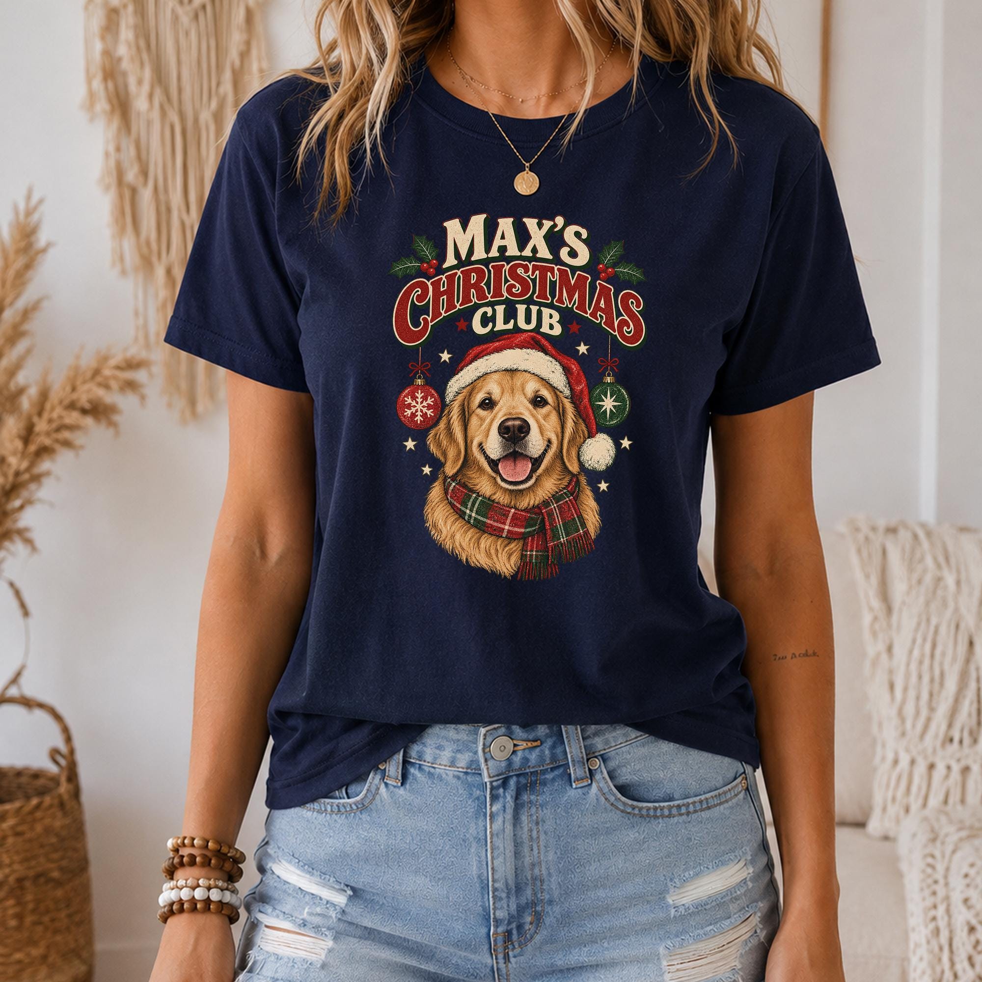 A woman wearing a navy blue t-shirt with a graphic of a dog and Christmas decorations.