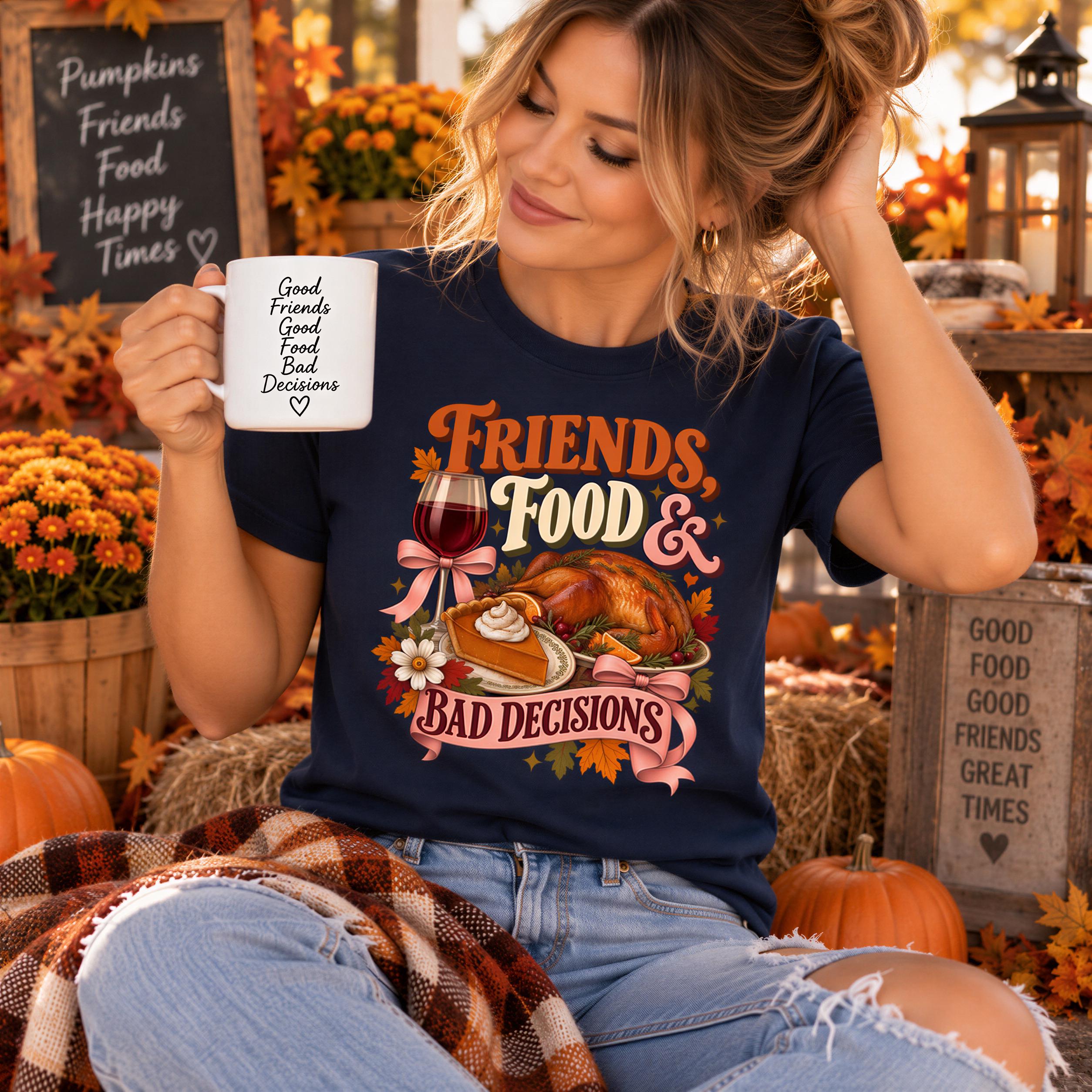 A woman wearing a black t-shirt with a graphic design of a turkey and pumpkin, holding a coffee mug and surrounded by fall decorations.