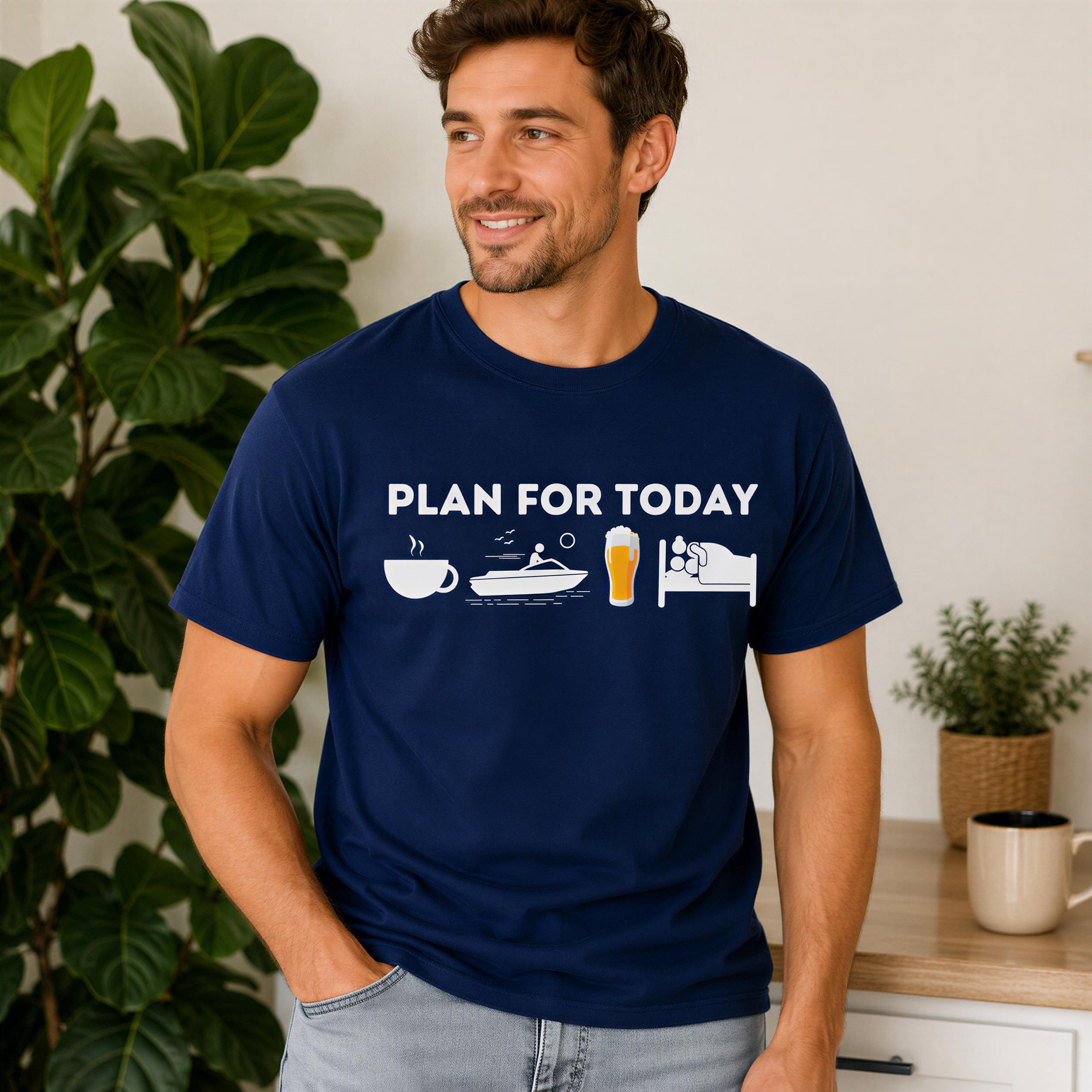A man wearing a navy blue t-shirt with the text "PLAN FOR TODAY" and various icons, including a cup, a boat, and a bed, standing in front of a plant.