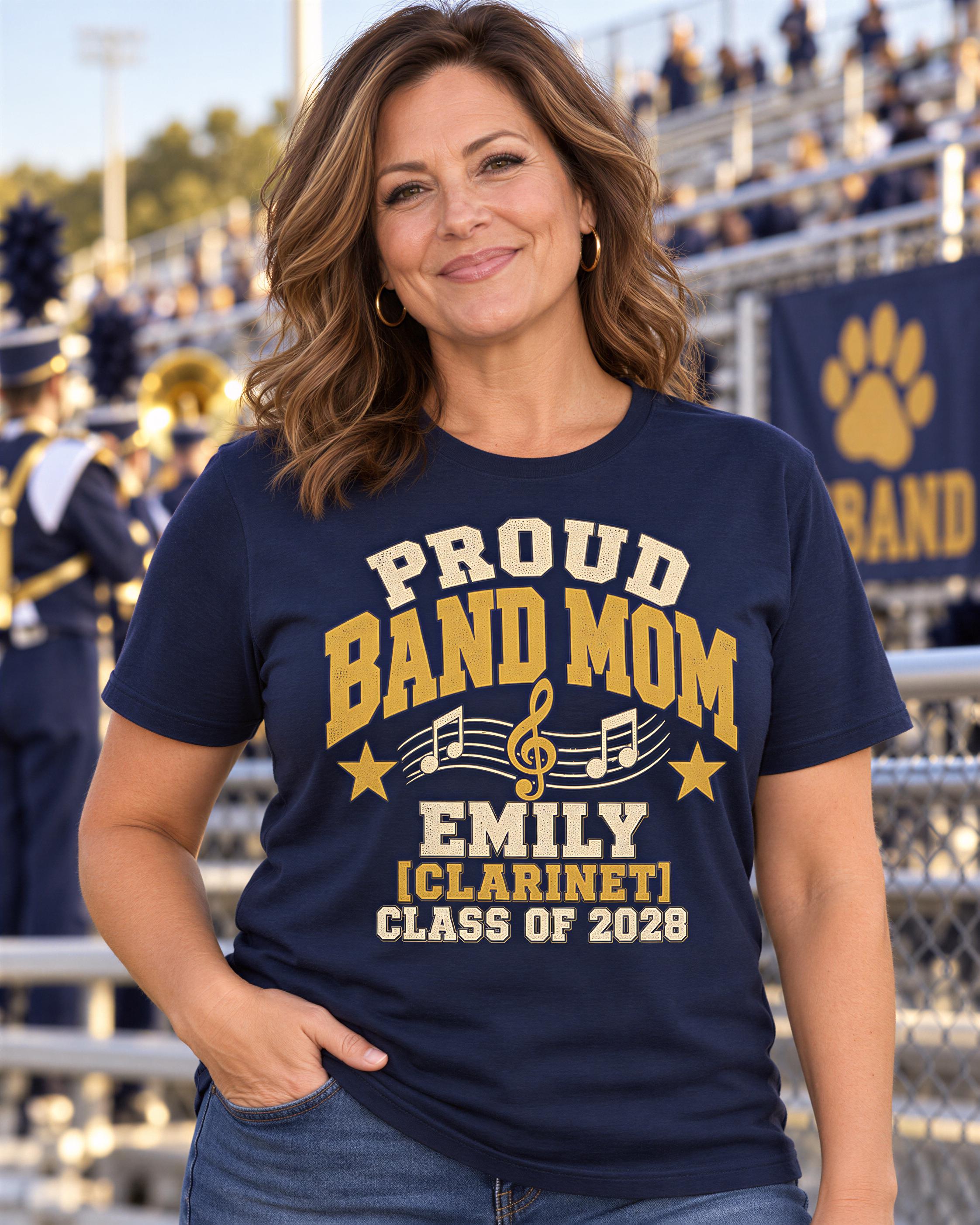 A woman wearing a navy blue t-shirt with text and a musical symbol, smiling at the camera.