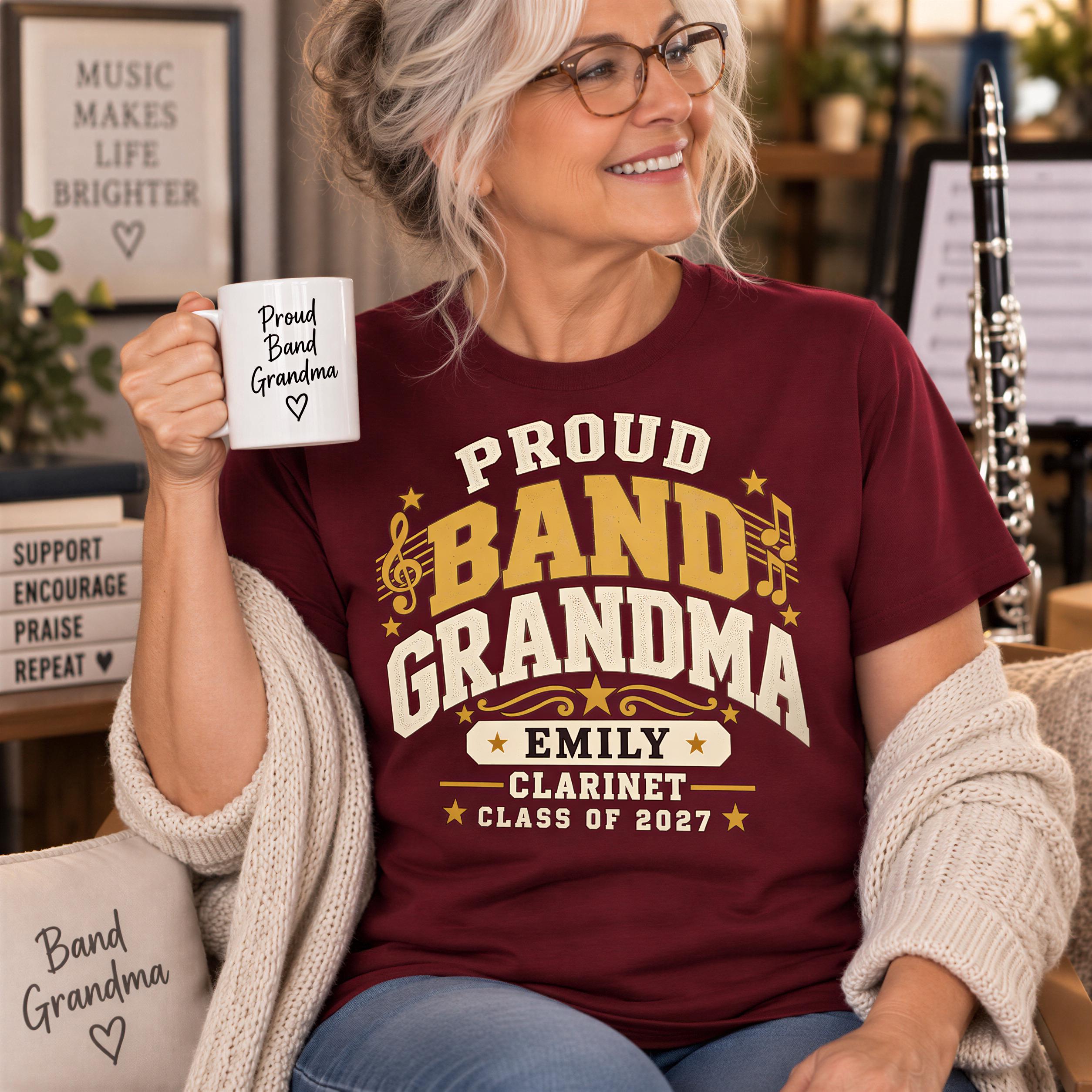 A smiling older woman wearing a maroon t-shirt with text and a musical instrument in the background.