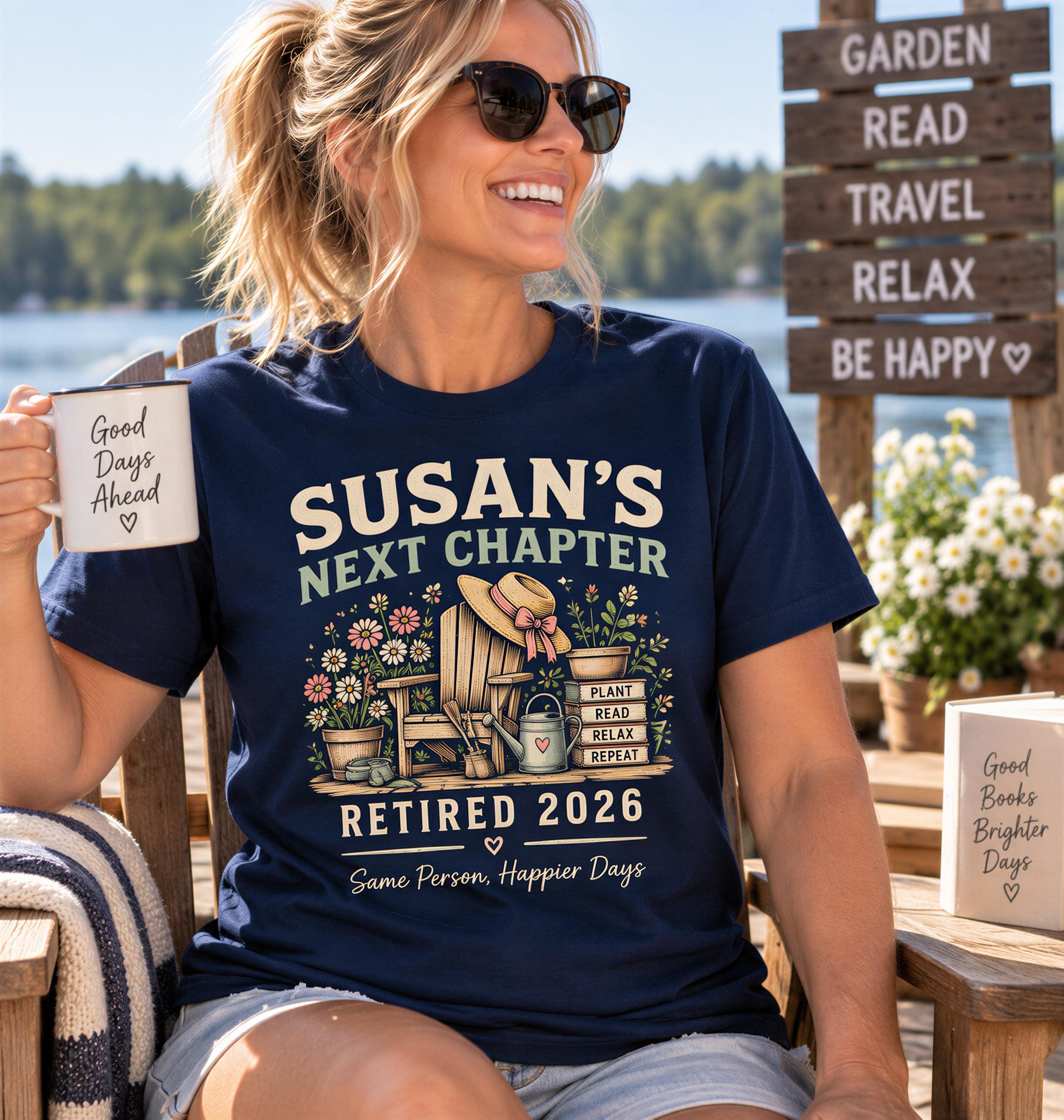A woman wearing sunglasses and a blue t-shirt with a graphic design is sitting on a bench, holding a coffee mug and smiling.