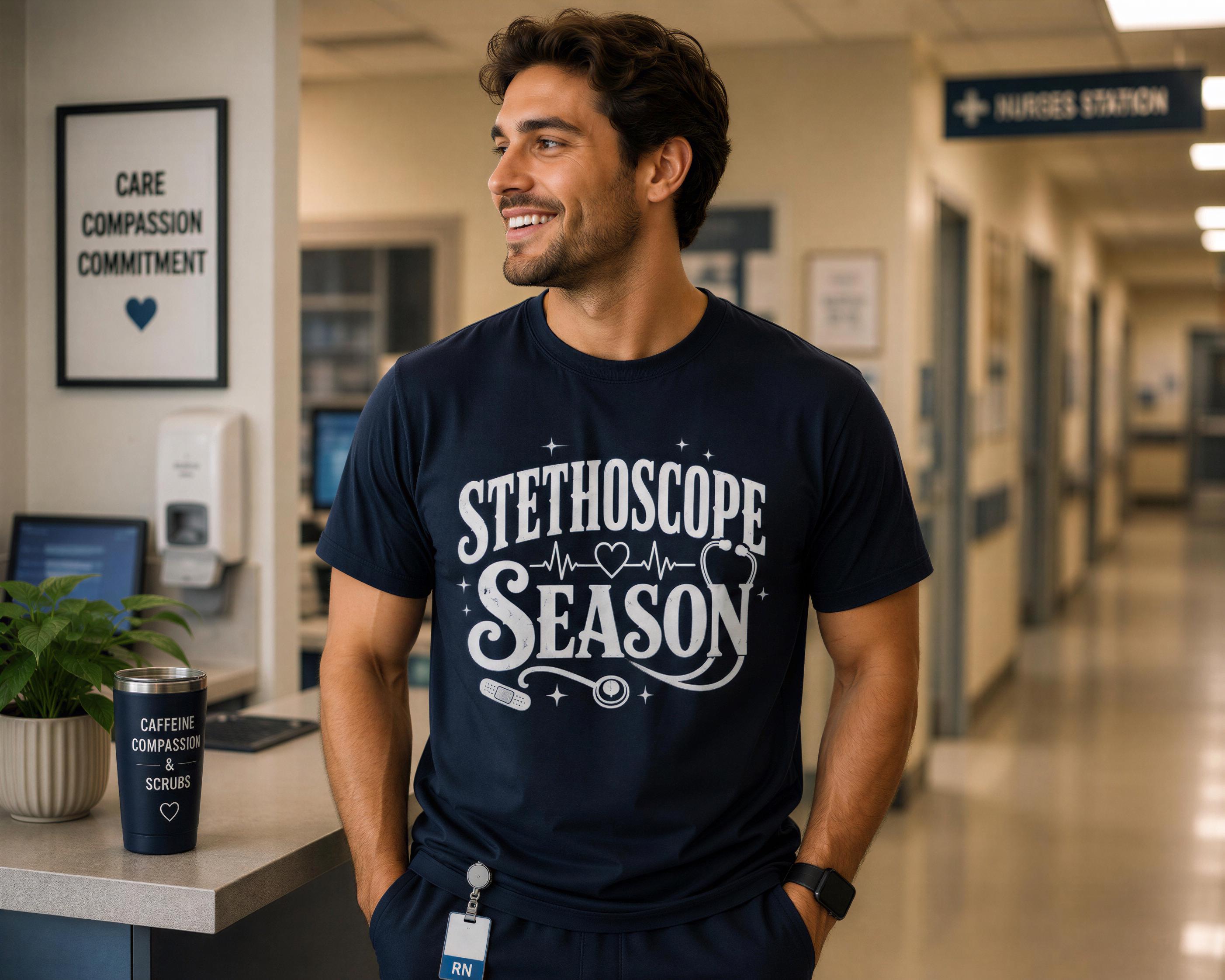 A man wearing a navy blue t-shirt with the text "STEHLSCOPE SEASON" stands in a hospital hallway, smiling.