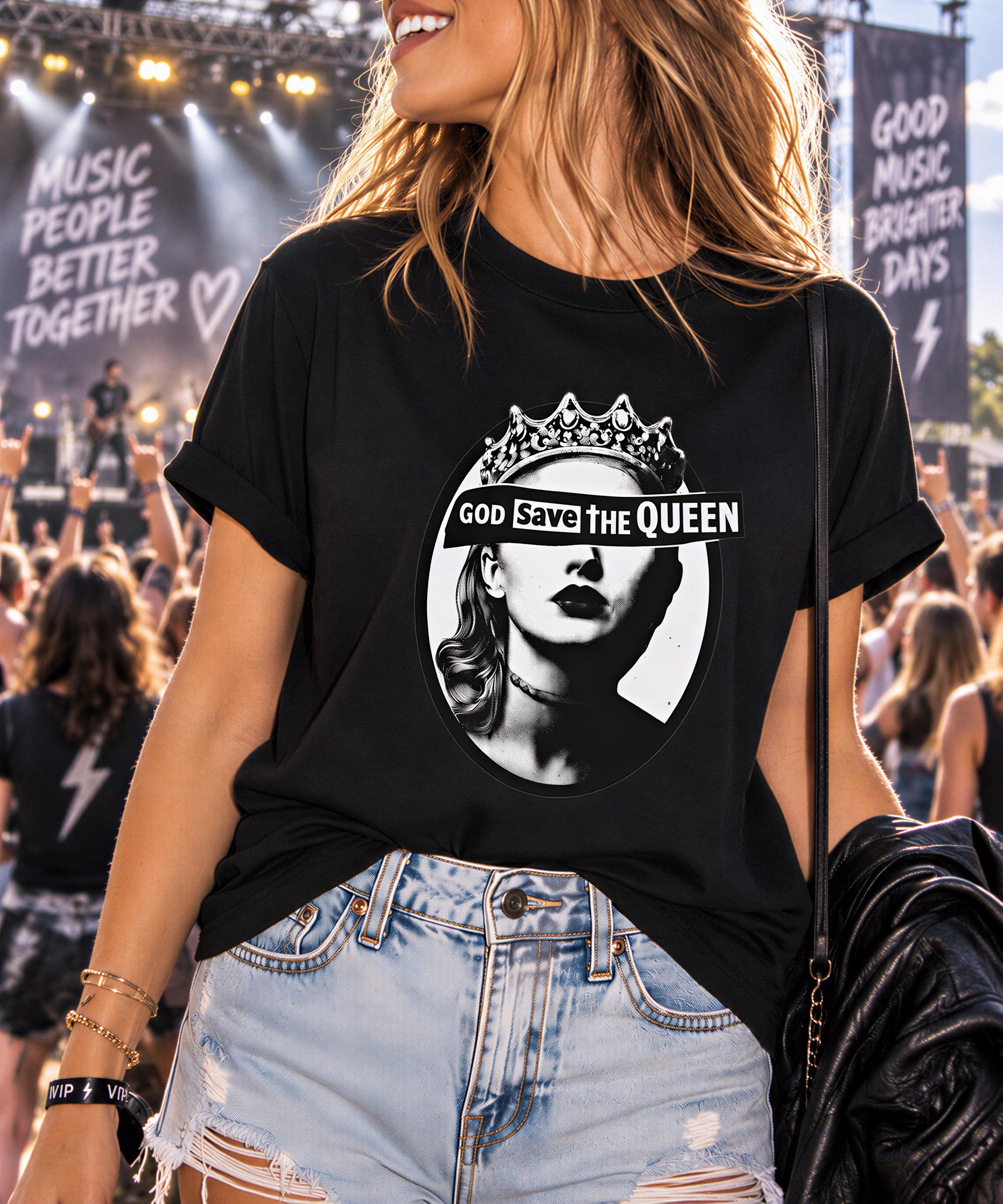 A woman wearing a black t-shirt with a graphic design and text, standing in front of a crowd at what appears to be a music event.