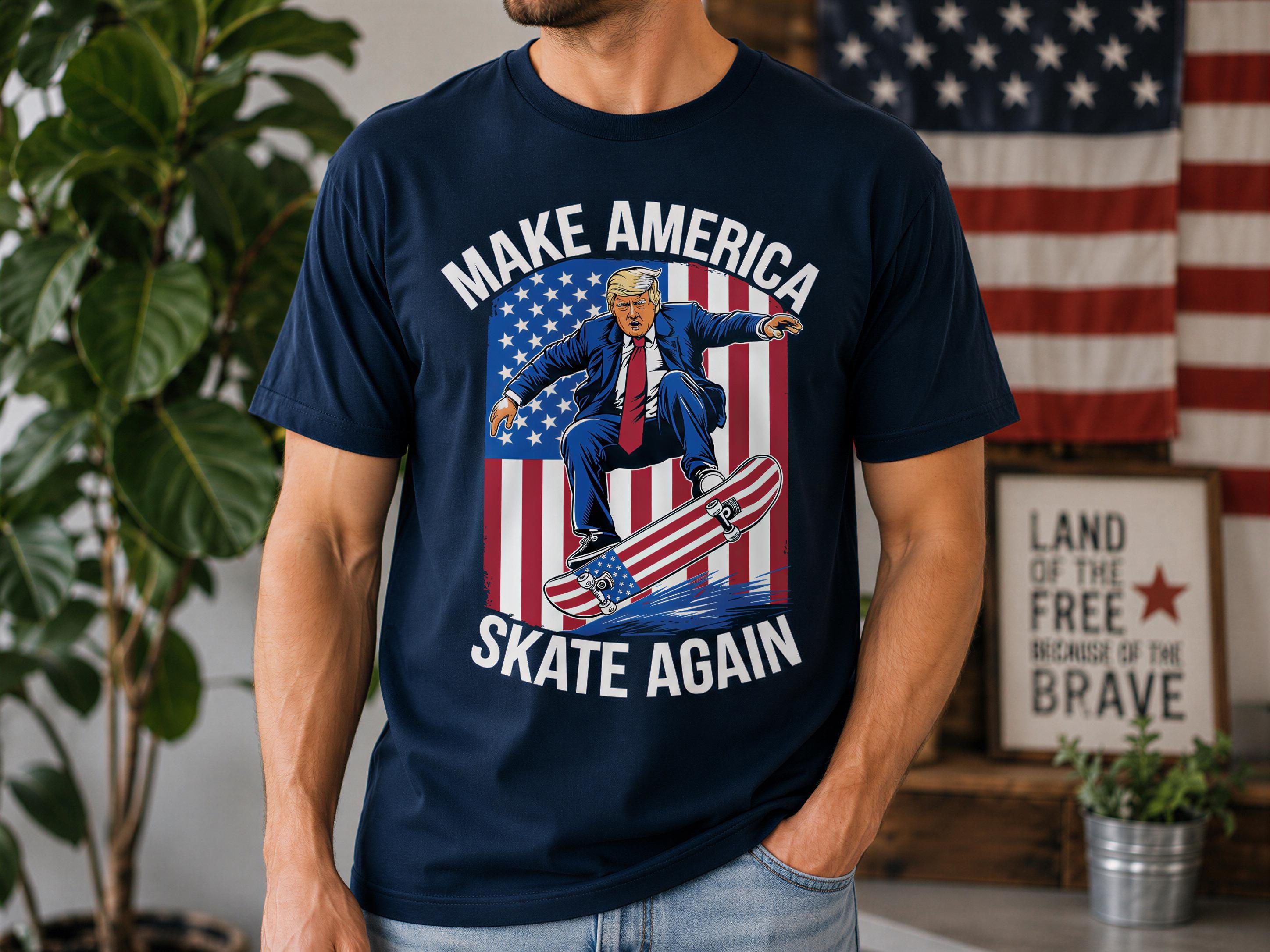 A man wearing a blue t-shirt with a graphic design of a man on a skateboard and an American flag in the background.