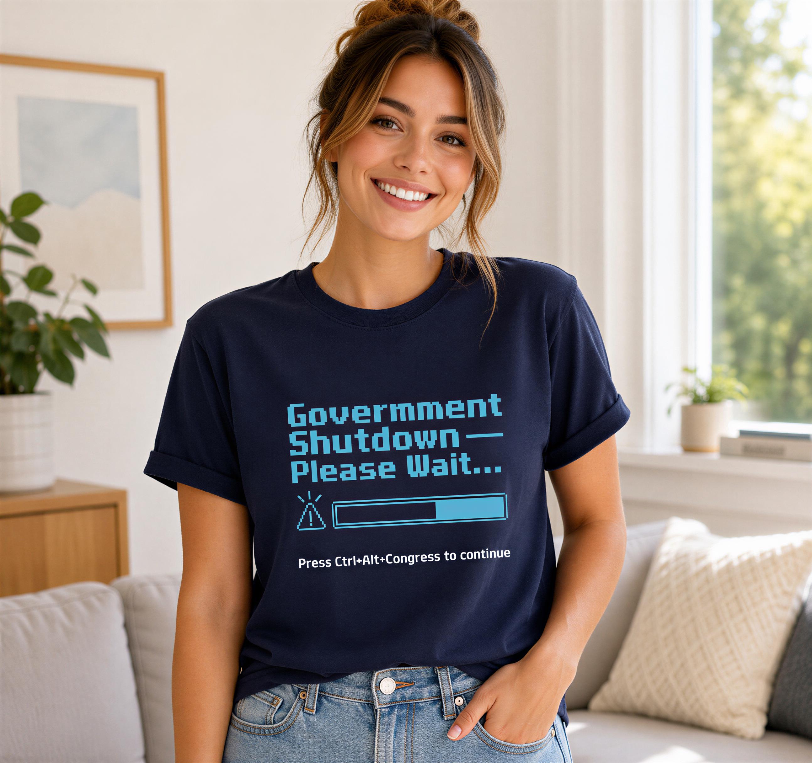 A woman wearing a navy blue t-shirt with a humorous text graphic and a progress bar, smiling at the camera.