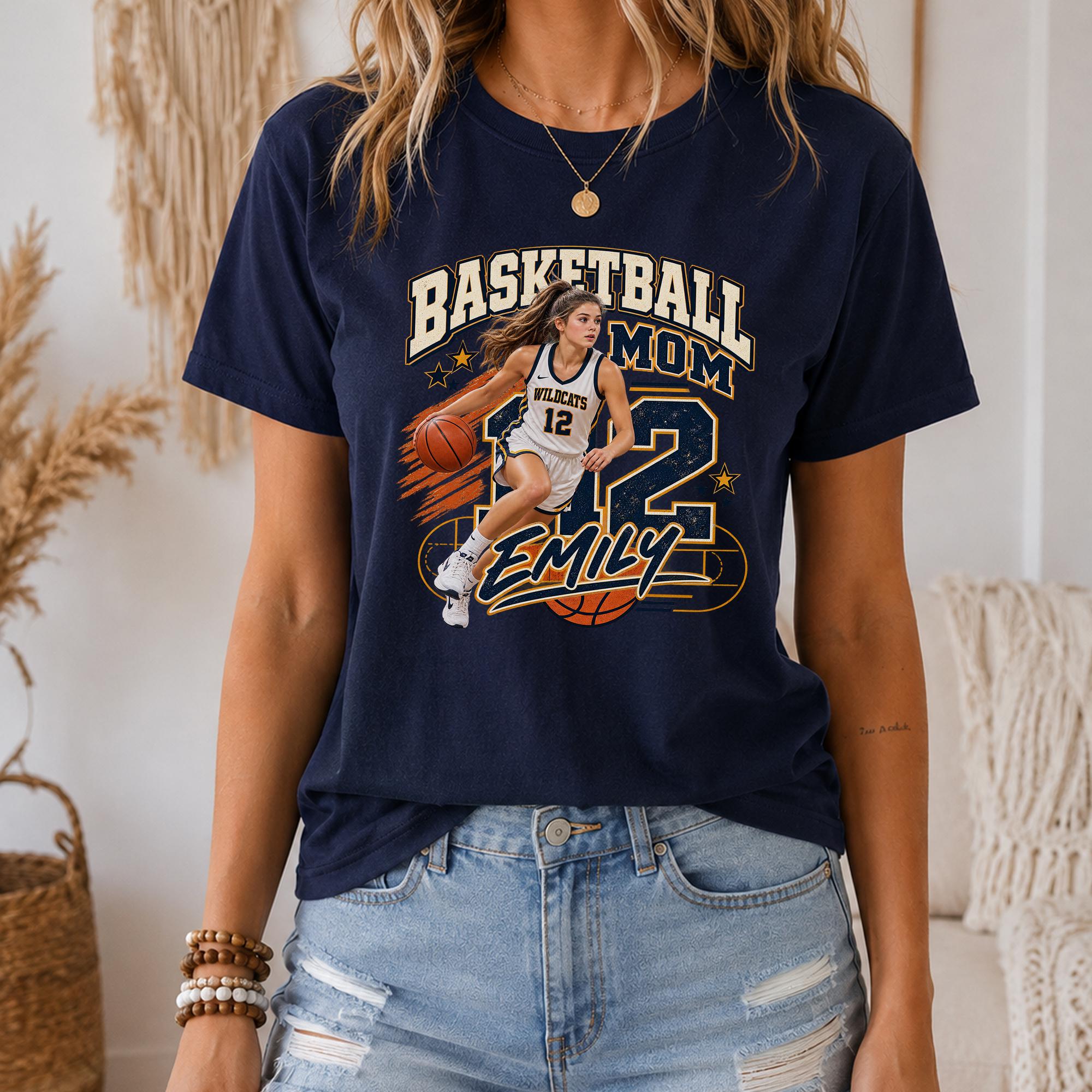 A woman wearing a navy blue t-shirt with a basketball graphic and the text "BASKETBALL MOM EMILY" printed on it.