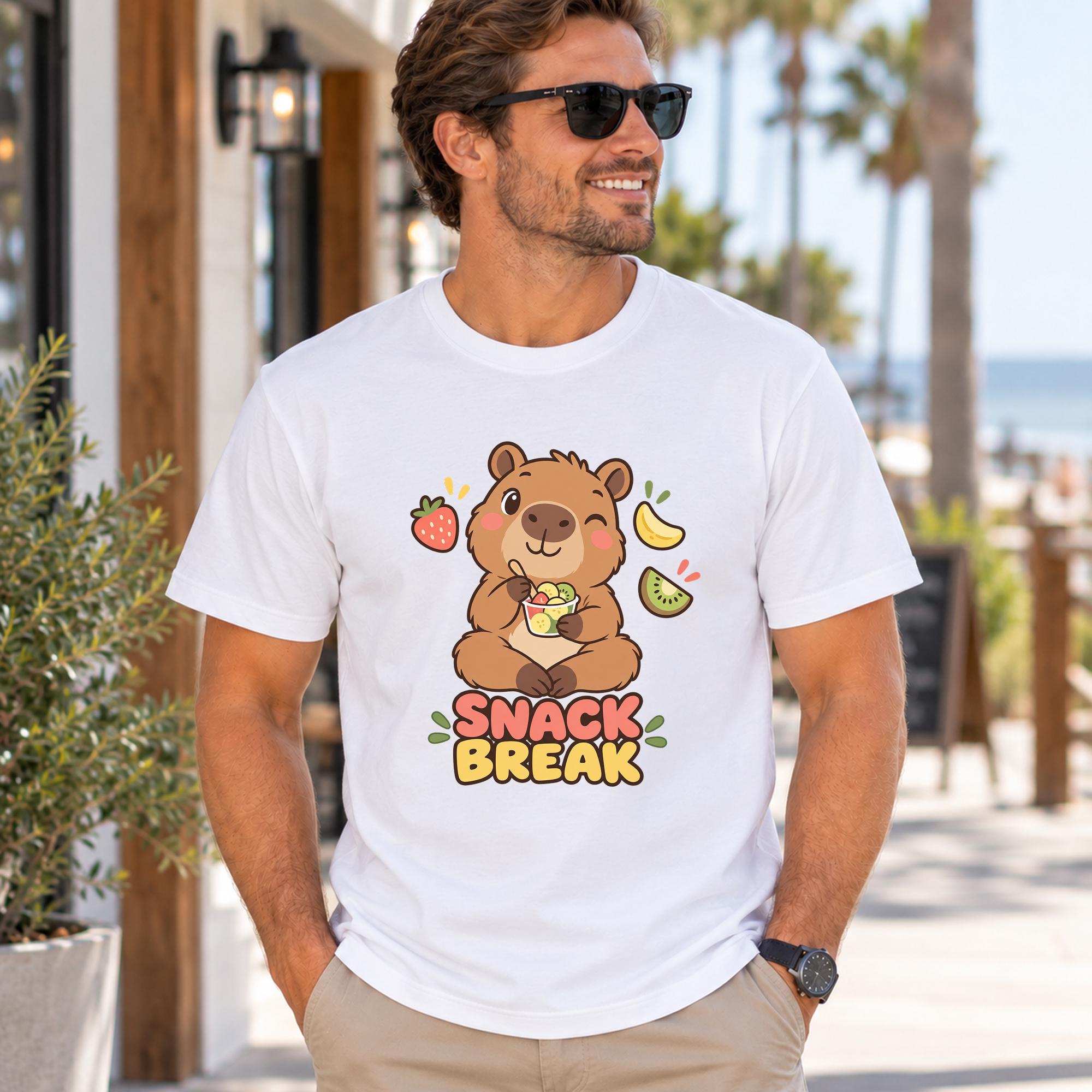 A man wearing a white t-shirt with a cartoon image of a bear and the text "SNAACK BREAK" is standing outdoors.