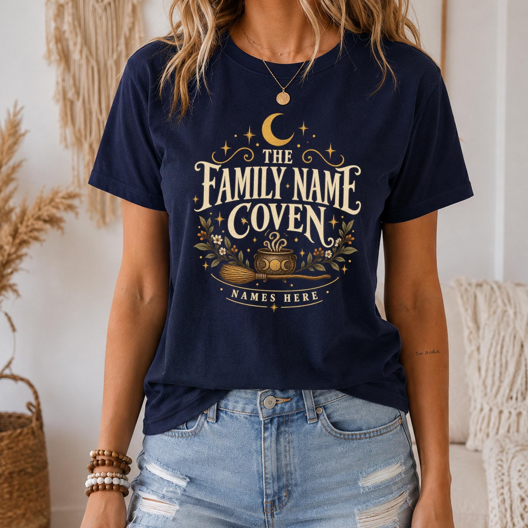A woman wearing a navy blue t-shirt with a graphic design that says "The Family name Coven Names Here".