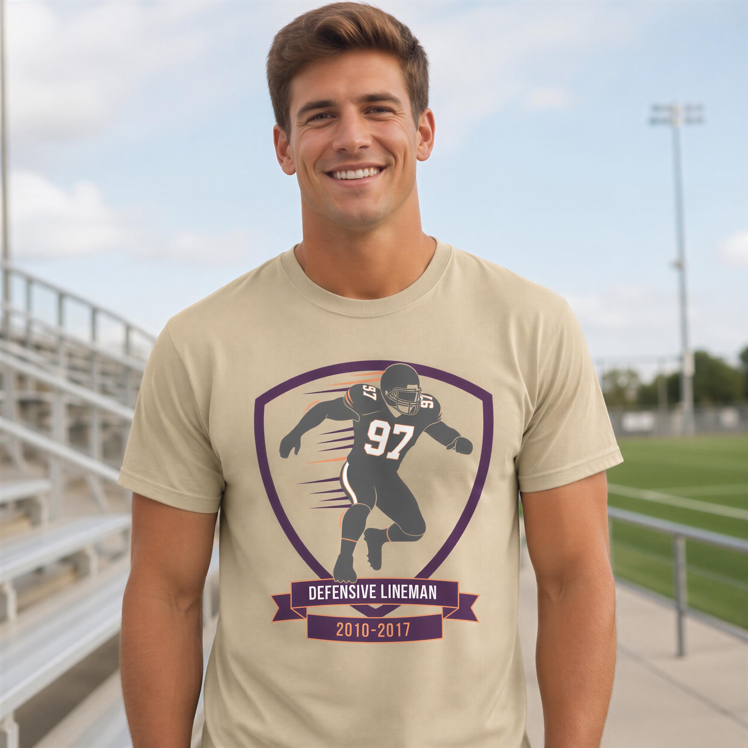 A smiling man wearing a t-shirt with a graphic of a football player and text that reads "Defensive Lineman 2010-2017".