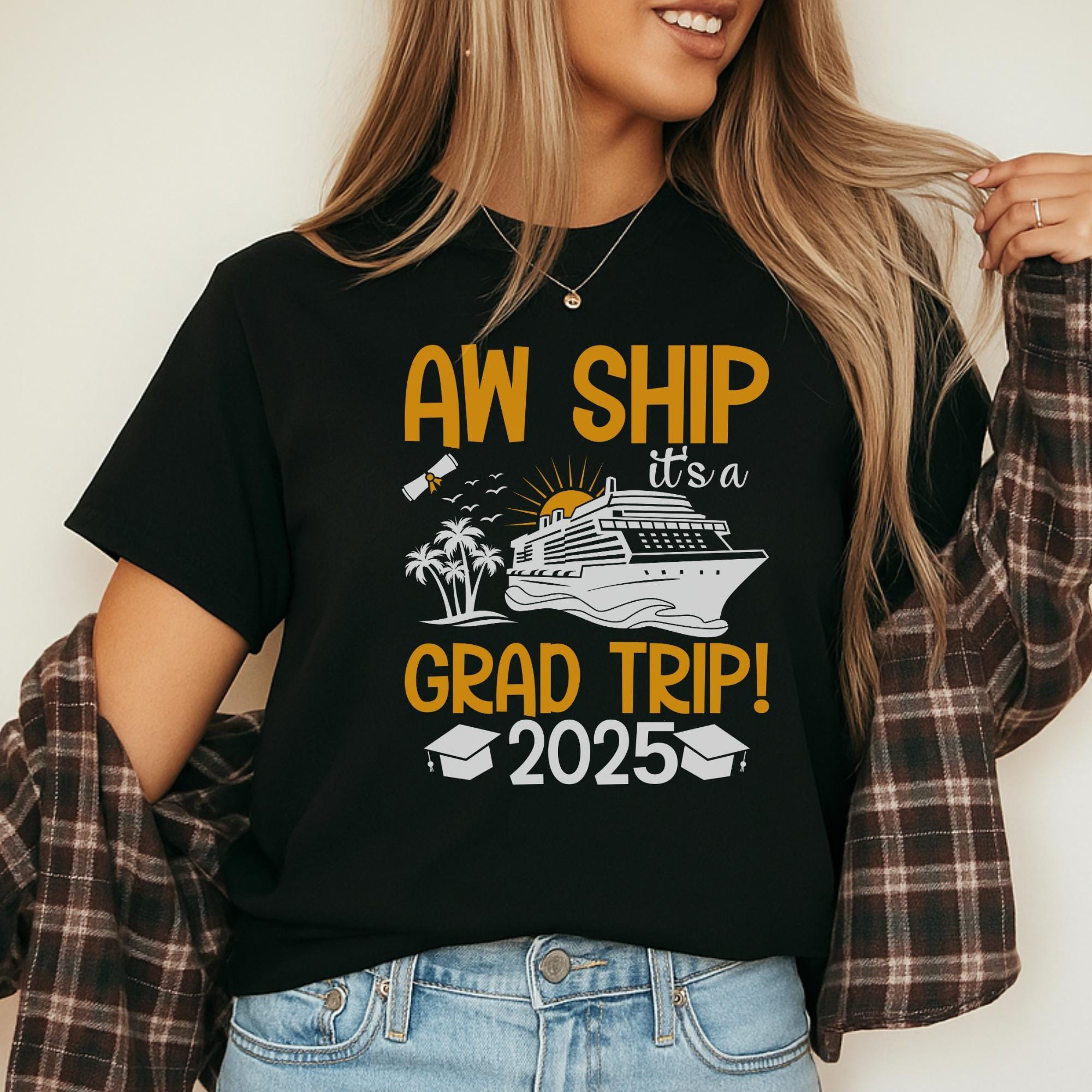 A woman wearing a black t-shirt with a graphic design that says "AW SHIP IT'S A GRAD TRIP! 2025" and features a cruise ship and graduation cap.