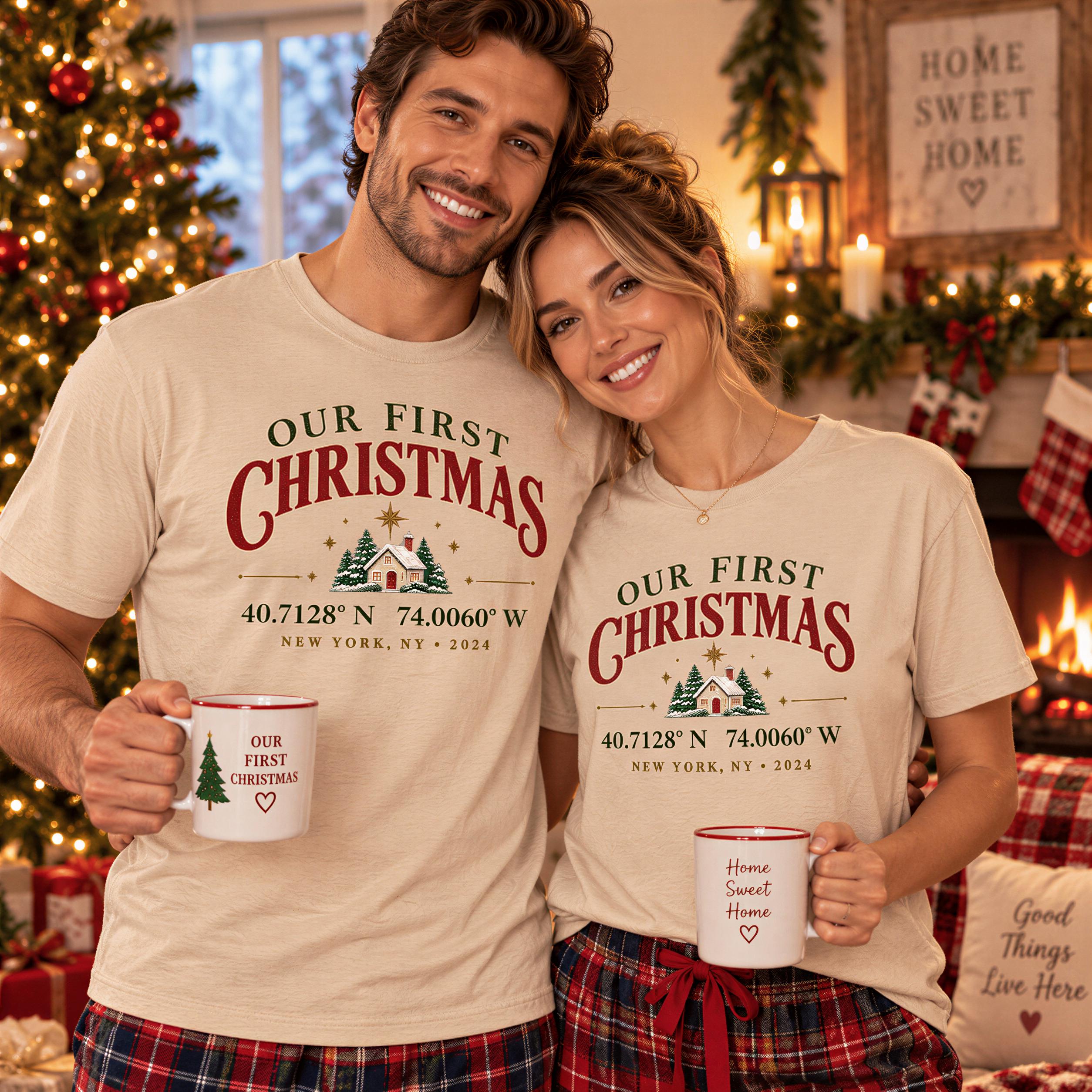 A man and a woman are standing together, both wearing matching t-shirts with the text "Our First Christmas" printed on them. They are holding coffee mugs in their hands, and there is a Christmas tree visible in the background.