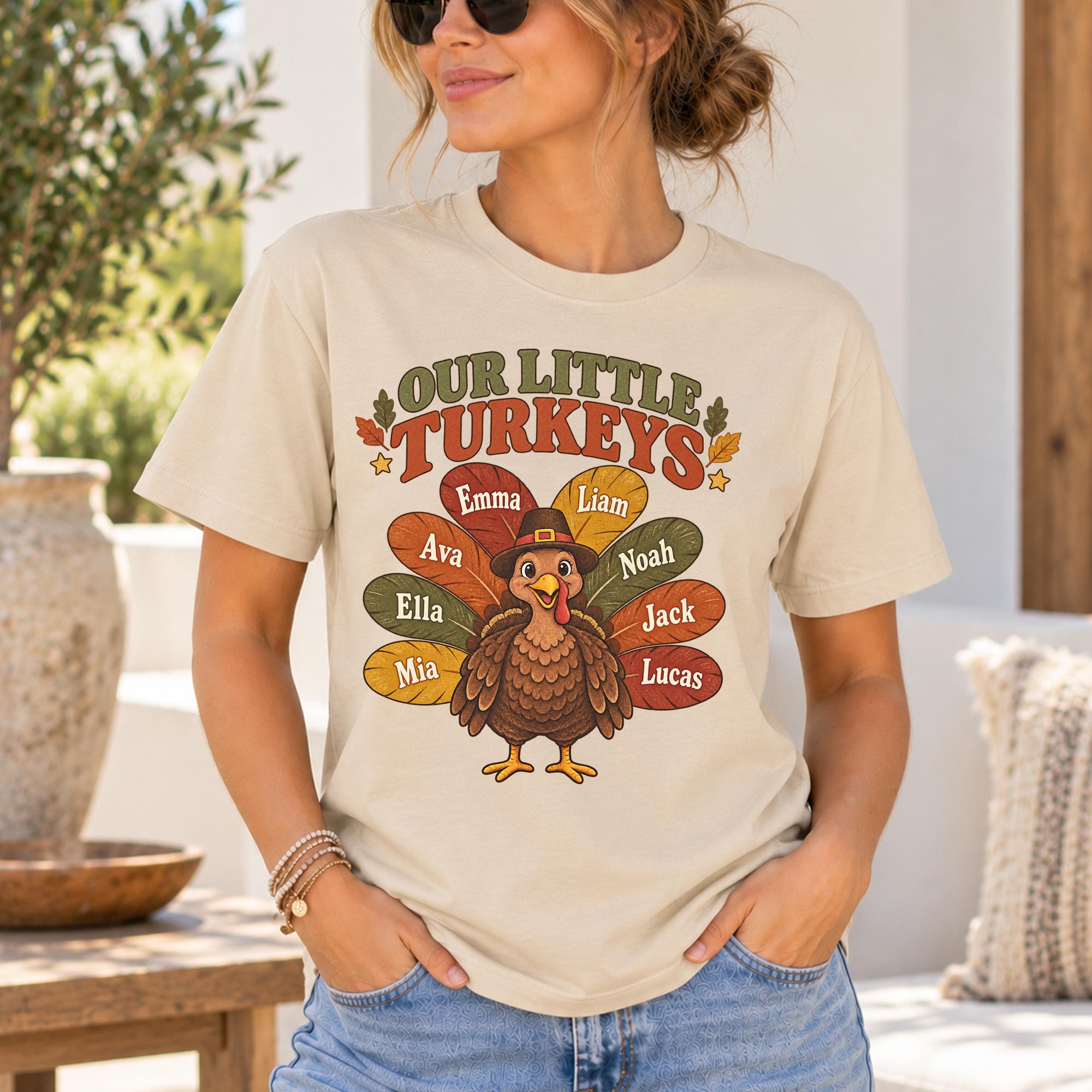 A woman wearing a t-shirt with a turkey graphic and the names of her family members surrounding it.