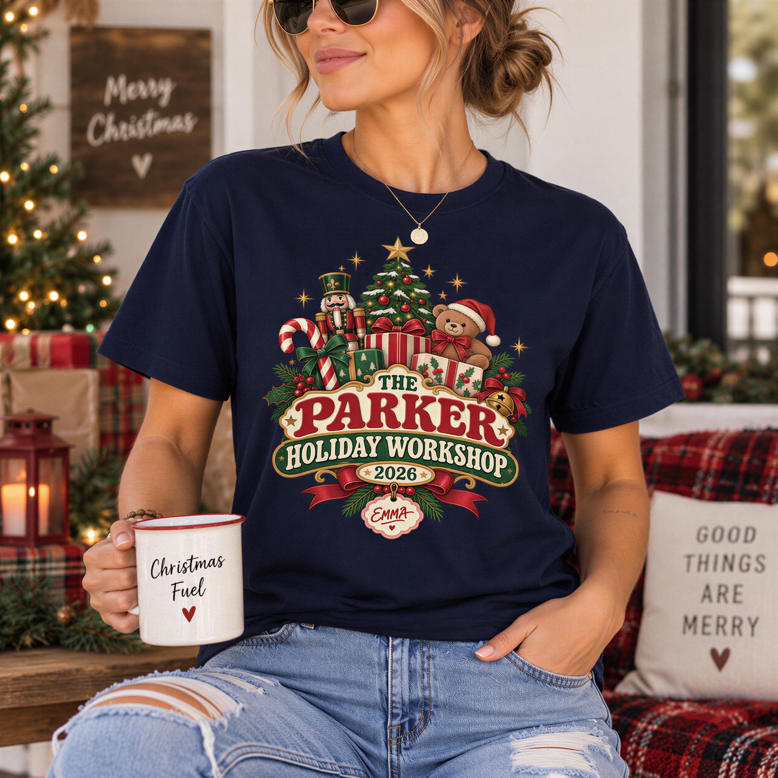A woman wearing a navy blue t-shirt with a Christmas-themed graphic and holding a coffee mug with the text "Christmas Fuel" printed on it.