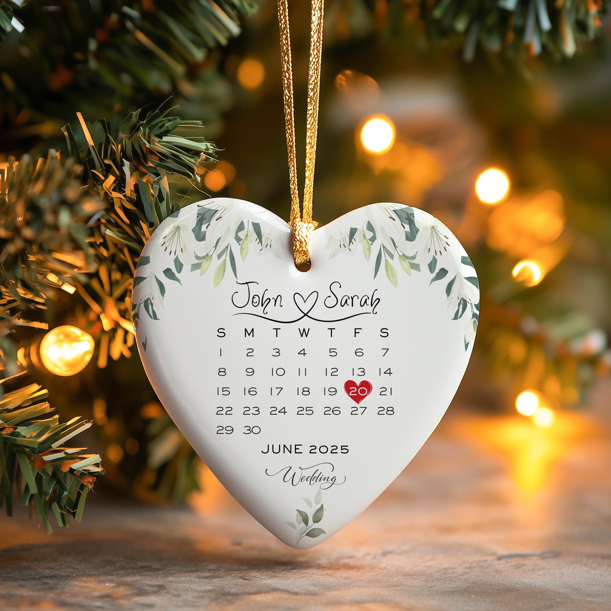 a heart shaped ornament hanging from a christmas tree