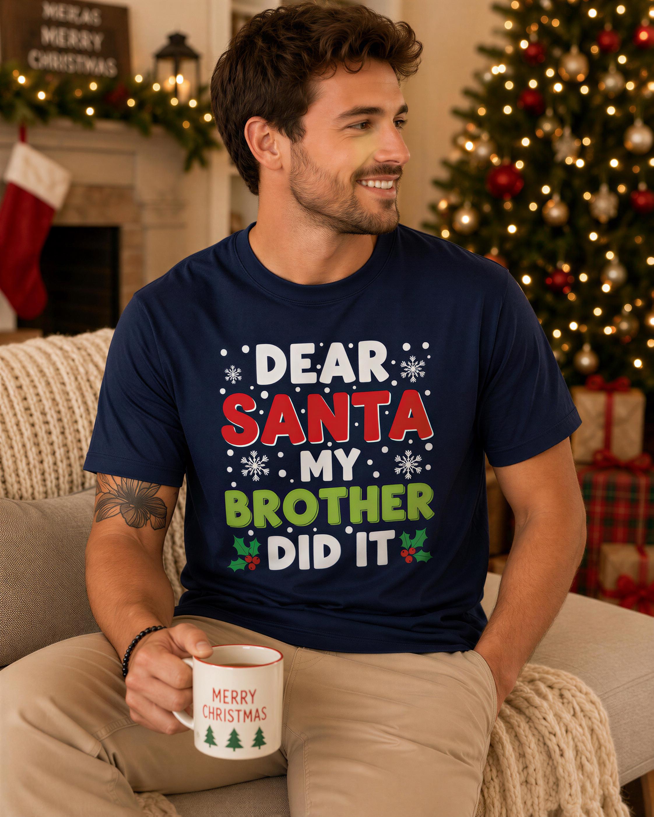A man wearing a navy blue t-shirt with a humorous Christmas-themed text is sitting on a couch, holding a coffee mug.