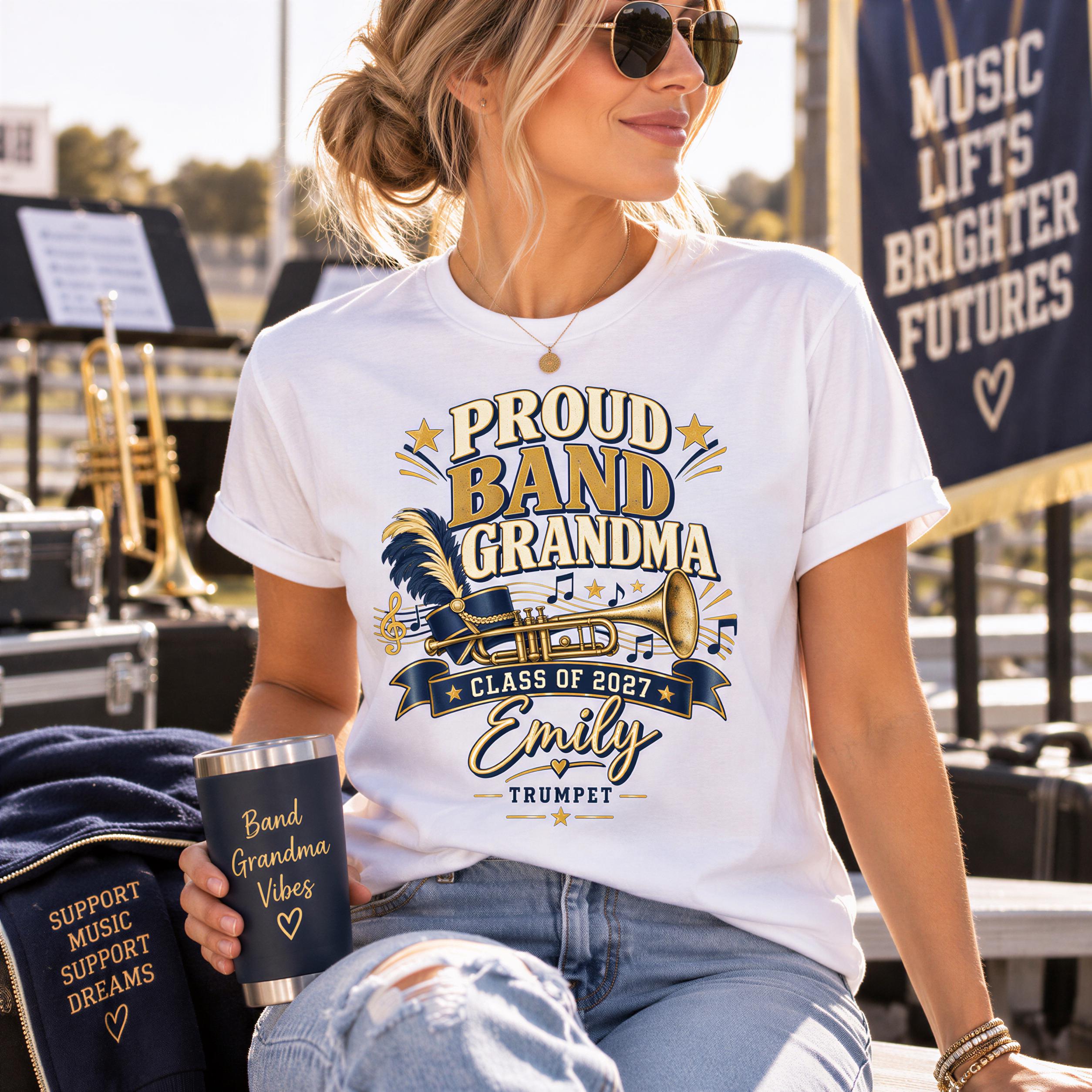 A woman wearing a white t-shirt with a graphic design, holding a black tumbler with text on it, and sitting in front of a banner that says "Music Lifts Brighter Futures".