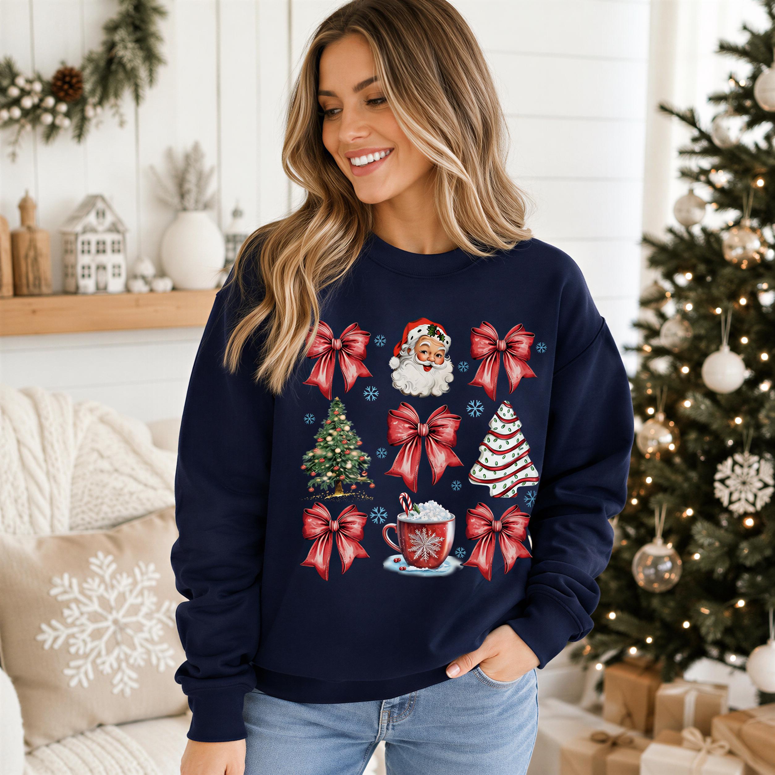 A woman wearing a navy blue sweater with Christmas-themed designs, including a Santa Claus, Christmas tree, and red bows, stands in front of a decorated Christmas tree.