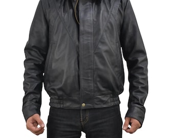 May include: A black leather jacket with a collared neckline and a zipper closure. The jacket features a bomber-style design with a ribbed hem and cuffs. The jacket has a classic, timeless look.