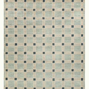 May include: A rectangular area rug featuring a grid pattern of light blue squares separated by beige horizontal and vertical bands. Small dark navy blue squares are positioned at each intersection of the beige bands, creating a repeating geometric design.