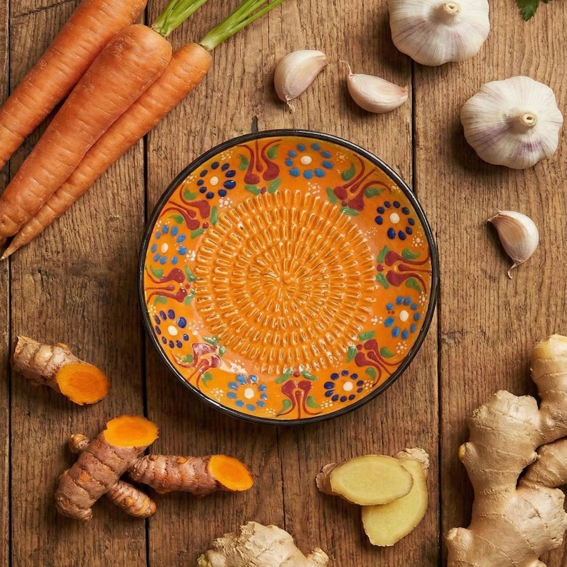 Handmade ceramic garlic grater plate with textured center