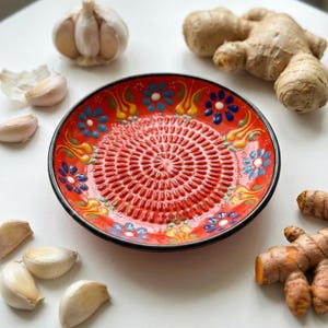 Handcrafted ceramic sauce dish with grater surface