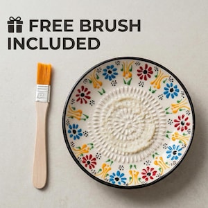 Artisan ceramic garlic grater dish with hand-painted floral design