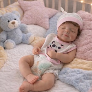 May include: A rustic wooden sign with the text "Welcome to our home" in white lettering. The sign features a distressed finish and a simple, inviting design, perfect for a front porch or entryway.