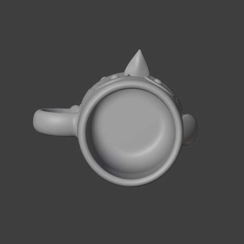 May include: A gray mug with a handle, a rounded base, and a decorative top with a pointed finial. The mug has a circular opening and a small, rounded detail on the side.