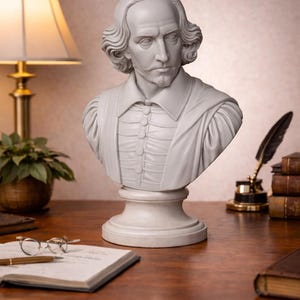May include: A white bust of William Shakespeare, featuring detailed facial features and a classic collar. The sculpture sits on a pedestal, evoking a sense of historical elegance. The bust is placed on a wooden desk, alongside a lamp, books, and writing materials.