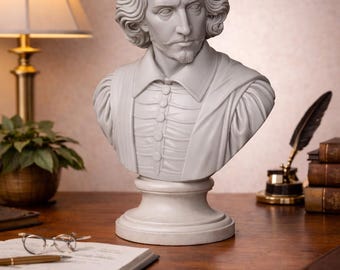 May include: A white bust of William Shakespeare, featuring detailed facial features and a classic collar. The sculpture sits on a pedestal, evoking a sense of historical elegance. The bust is placed on a wooden desk, alongside a lamp, books, and writing materials.