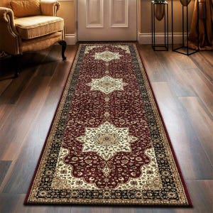 May include: A long, rectangular runner rug with a deep red background and intricate floral patterns in cream, black, and gold. The rug features a central medallion design and borders with detailed motifs, suitable for a hallway or entryway.