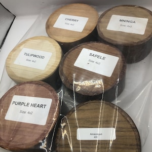 May include: Six wooden blocks of varying wood types and colours, from light tan to dark brown. Each block has a label with the wood type and size, 4x2 inches (approx. 10x5 cm). The blocks are packaged in clear plastic.
