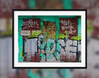 One wall, two atmospheres -- Colored graffiti on a wall [Pointe-à-Pitre, Guadeloupe]