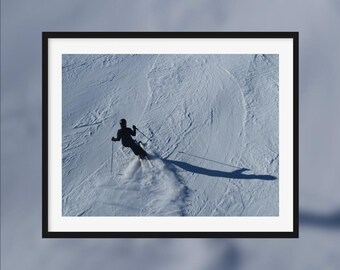 Winter adrenaline -- A skier going down the snow-covered slope [Val d'Isère, France]