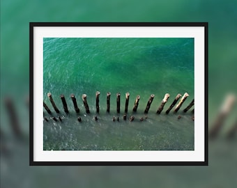 Tireless keepers -- Wood poles in the sea protecting the coast [Saint-Malo, France]
