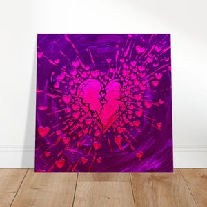 May include: A square canvas art piece featuring a broken heart design. The heart is split in two, with a burst of smaller hearts radiating outwards. The background is a deep purple with pink accents, creating a dramatic effect.