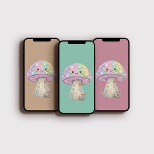 Pode incluir: Três smartphones exibindo um design de cogumelo caprichoso. Cada cogumelo tem um chapéu colorido com um rosto sorridente e um caule detalhado. Os fundos dos telefones são bege, turquesa e rosa.