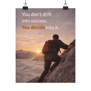 May include: A motivational poster featuring a person climbing a mountain towards a sunset. The poster has the text "You don't drift into success. You decide into it." The person wears a backpack and is scaling a rocky cliff.