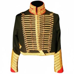May include: A black military-style jacket with gold-colored trim and buttons. The jacket features a high collar with red and gold embroidery, gold braid detailing, and gold accents on the sleeves. The jacket is cropped at the waist.