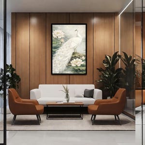 May include: A framed print of a white peacock with a long tail, standing on a rock surrounded by water lilies. The artwork is set in a room with a white sofa, brown armchairs, and a wooden coffee table. The room has wooden paneling.