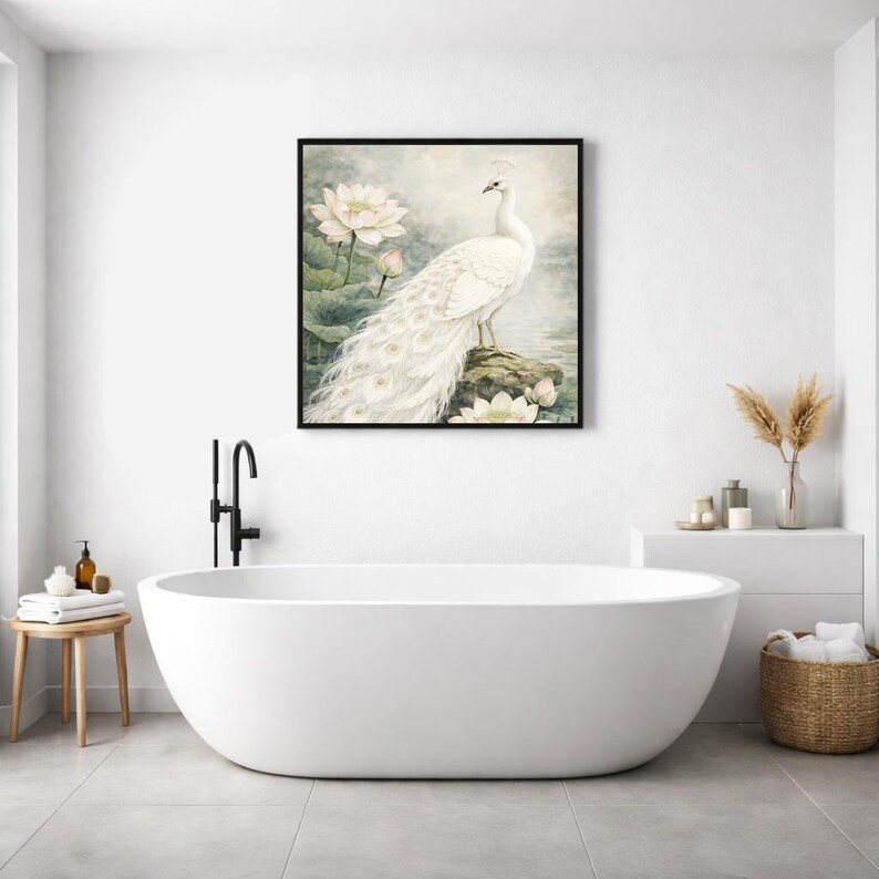 May include: A framed art print depicting a white peacock on a rock, with lotus flowers. The artwork has a soft, watercolour style and a black frame. The image is displayed above a white, oval bathtub in a modern bathroom setting.