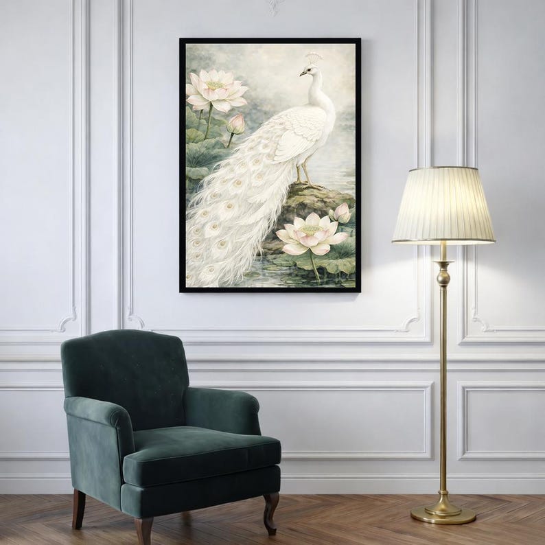 May include: A framed art print depicting a white peacock with a long tail, standing on a rock near lotus flowers. The artwork has a soft, watercolour style with a serene, natural theme. The frame is black.