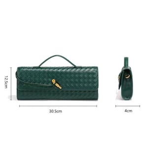 May include: A dark green woven leather handbag with a top handle and a gold-coloured clasp. The bag is rectangular, measuring 12.5 cm high, 30.5 cm wide, and 4 cm deep. The bag is shown from the front and side.